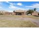 Grand front entrance features stone pillars and manicured lawn at 6151 Moonlight Sonata Ave, Las Vegas, NV 89122