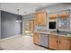 Bright kitchen nook with stainless steel appliances and sliding glass door to the backyard at 6151 Moonlight Sonata Ave, Las Vegas, NV 89122