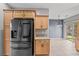 Modern kitchen with stainless steel appliances and a view into the dining area at 6151 Moonlight Sonata Ave, Las Vegas, NV 89122