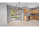 Bright kitchen nook with stainless steel appliances and sliding glass door to backyard at 6151 Moonlight Sonata Ave, Las Vegas, NV 89122