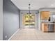 Bright kitchen nook with stainless steel appliances and sliding glass door to backyard at 6151 Moonlight Sonata Ave, Las Vegas, NV 89122