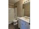 Clean bathroom with tub, toilet, vanity, and mirror at 6460 Raven Hall St, North Las Vegas, NV 89084