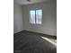 Bright bedroom with carpet and large window at 6460 Raven Hall St, North Las Vegas, NV 89084