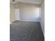 Large bedroom with neutral walls and carpet at 6460 Raven Hall St, North Las Vegas, NV 89084