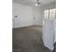 Bright and airy entryway with neutral walls and carpet at 6460 Raven Hall St, North Las Vegas, NV 89084