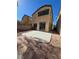 Two-story house with sliding glass doors and a patio at 6460 Raven Hall St, North Las Vegas, NV 89084