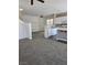 Kitchen with white cabinets, a center island, and gray flooring at 6460 Raven Hall St, North Las Vegas, NV 89084