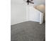 Bright and airy living room featuring ceiling fan and gray carpet at 6460 Raven Hall St, North Las Vegas, NV 89084