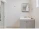 Bathroom featuring a vanity sink, modern mirror, and neutral decor at 659 D Ave, Boulder City, NV 89005