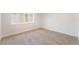 Bedroom with neutral carpet and a large window offering natural light at 659 D Ave, Boulder City, NV 89005