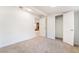 Bedroom with neutral carpet, closet, and doorway to living room at 659 D Ave, Boulder City, NV 89005