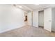 Bedroom with neutral carpet, closet, and doorway to living room at 659 D Ave, Boulder City, NV 89005