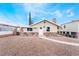 Charming single-story home featuring rock accents, a stone archway, and a gravel-covered yard at 659 D Ave, Boulder City, NV 89005