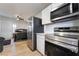 This kitchen includes stainless steel appliances and a view of the adjacent bedroom at 659 D Ave, Boulder City, NV 89005