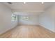 Bright, spacious room with light wood flooring and natural light from windows at 659 D Ave, Boulder City, NV 89005