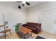 Cozy living room with wood-look floors and a comfortable leather sofa at 659 D Ave, Boulder City, NV 89005