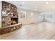 Cozy living room with stone fireplace and natural light from multiple windows at 659 D Ave, Boulder City, NV 89005