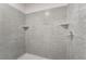 Updated shower with attractive tile and built-in shelf at 659 D Ave, Boulder City, NV 89005