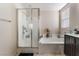 Bathroom features a shower, bathtub, and vanity at 6713 Chambers Lake Ct, North Las Vegas, NV 89084