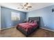 Bedroom with a large bed and ceiling fan at 6713 Chambers Lake Ct, North Las Vegas, NV 89084