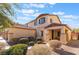 Two-story house with a two-car garage and desert landscaping at 6713 Chambers Lake Ct, North Las Vegas, NV 89084