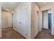 Upper hallway with carpet and access to bedrooms and closets at 6713 Chambers Lake Ct, North Las Vegas, NV 89084