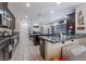 Modern kitchen with granite countertops and dark brown cabinets at 6713 Chambers Lake Ct, North Las Vegas, NV 89084