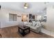 Open concept living room with sectional sofa and view into kitchen at 6713 Chambers Lake Ct, North Las Vegas, NV 89084