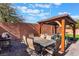 Patio furniture under a shaded pergola at 6713 Chambers Lake Ct, North Las Vegas, NV 89084