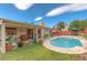 Inviting backyard oasis with a sparkling pool and relaxing patio area at 7200 Big Rock Cir, Las Vegas, NV 89129