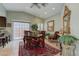 Bright dining area with glass-top table and seating for four, adjacent to kitchen at 7200 Big Rock Cir, Las Vegas, NV 89129