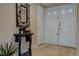 Elegant entryway showcasing a large mirror and double entry doors at 7200 Big Rock Cir, Las Vegas, NV 89129