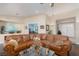 Relaxing living room with a large sectional sofa and hardwood floors at 7200 Big Rock Cir, Las Vegas, NV 89129