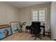 Home office with desk, chair, and artwork, featuring natural light at 7200 Big Rock Cir, Las Vegas, NV 89129