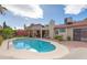 Relaxing kidney-shaped pool, spacious patio, and lush landscaping at 7200 Big Rock Cir, Las Vegas, NV 89129