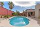 Stunning kidney-shaped pool with patio and landscape at 7200 Big Rock Cir, Las Vegas, NV 89129