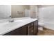 A full bathroom features a single sink vanity and a shower over the tub at 7516 Evening Melody Ct, Las Vegas, NV 89178