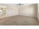 Spacious carpeted bedroom with a ceiling fan for added comfort at 7516 Evening Melody Ct, Las Vegas, NV 89178