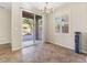 Bright dining area featuring sliding glass doors and a window with plantation shutters at 7516 Evening Melody Ct, Las Vegas, NV 89178