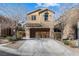 Two-story home featuring a two-car garage and a well-maintained front yard at 7516 Evening Melody Ct, Las Vegas, NV 89178