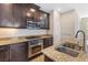 Granite countertops and modern stainless steel appliances adorn this kitchen at 7516 Evening Melody Ct, Las Vegas, NV 89178