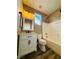 Modern bathroom with wood-look floors, white vanity, and bathtub at 773 Valley Rise Dr, Henderson, NV 89052