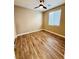 Bright bedroom featuring wood floors, a window, and ceiling fan at 773 Valley Rise Dr, Henderson, NV 89052