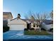 Single-story home with attached two-car garage and landscaped front yard at 773 Valley Rise Dr, Henderson, NV 89052