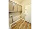 Laundry room with upper cabinets and door to outside at 773 Valley Rise Dr, Henderson, NV 89052