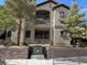 Inviting condo with charming curb appeal, featuring well-maintained landscaping and a private balcony at 8250 N Grand Canyon Dr # 1040, Las Vegas, NV 89166