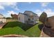 Manicured backyard featuring well-maintained lawn and a covered patio at 8389 Charlton Valley Ct, Las Vegas, NV 89123