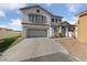 Charming two-story home with a two-car garage, manicured lawn, and a welcoming entrance at 8389 Charlton Valley Ct, Las Vegas, NV 89123