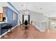 Open concept dining area with hardwood floors and modern chandelier at 8449 Kettledrum St, Las Vegas, NV 89139