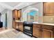 Bright kitchen with wood cabinets and granite countertops at 8449 Kettledrum St, Las Vegas, NV 89139